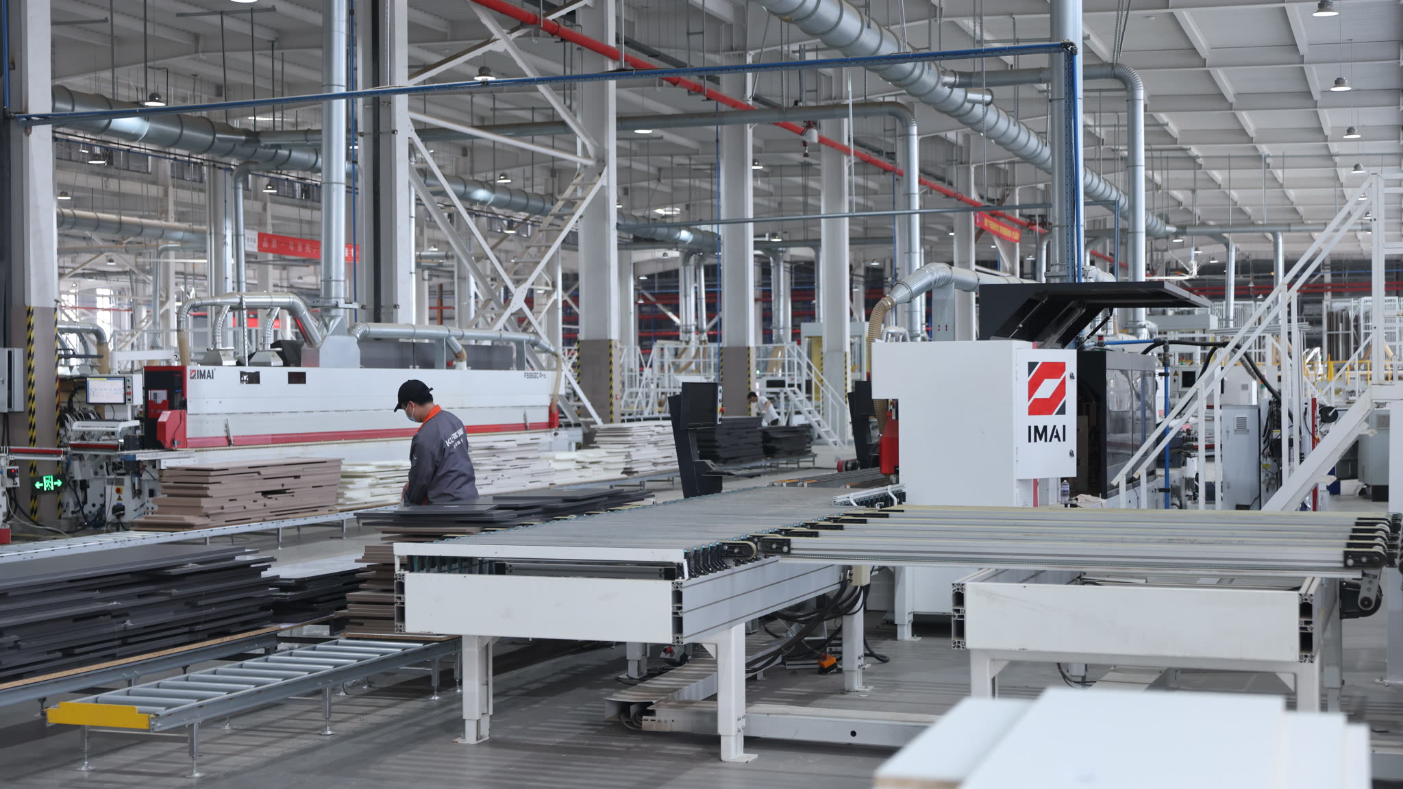 Water-based paint, shaped wood, and assembly lines support cabinets, doors, walls, and supporting systems.